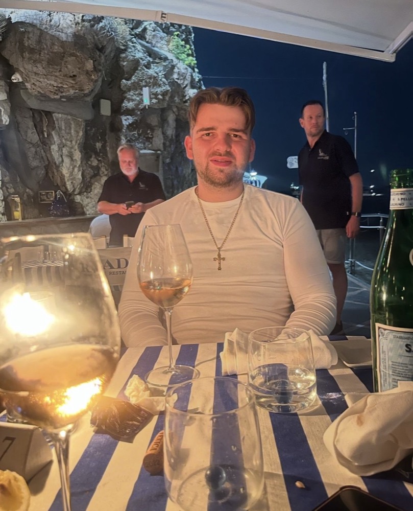 John now, out for dinner abroad, working off a laptop