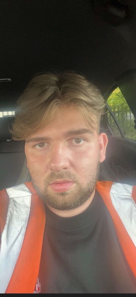 John before, in hi-vis sat in the van on site